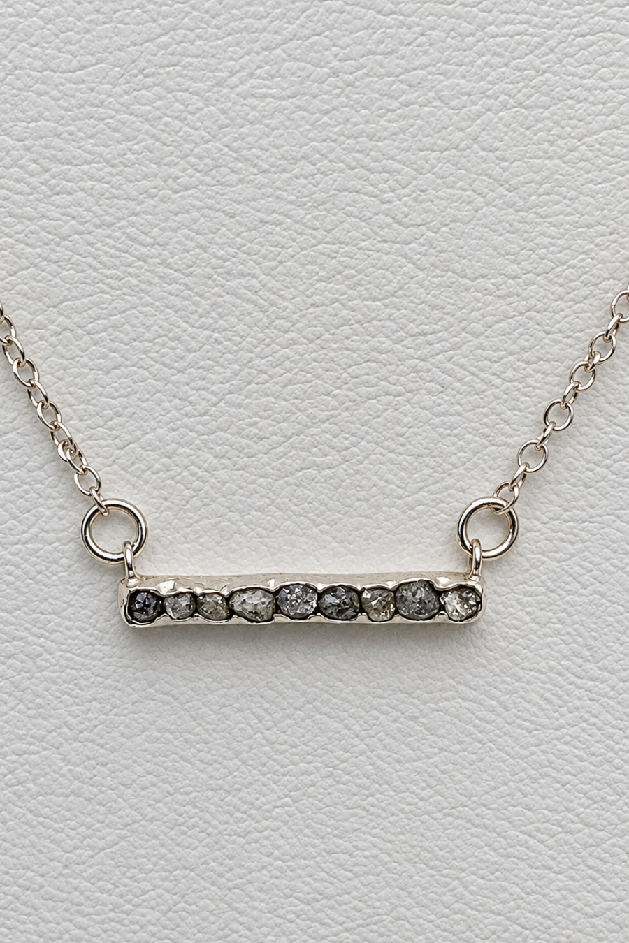 Silver plated necklace with dark grey faceted stone Bar