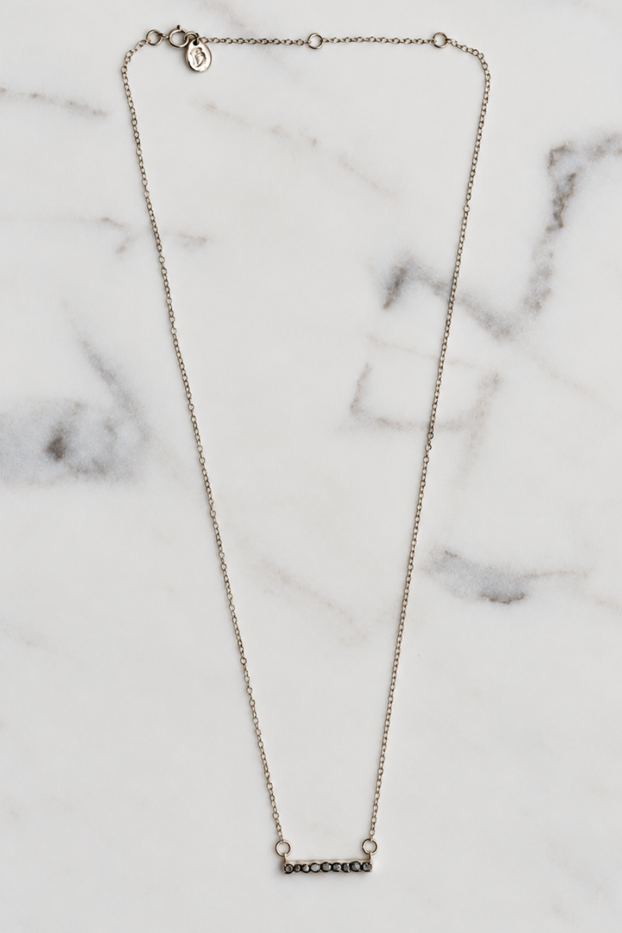Silver plated necklace with dark grey faceted stone Bar